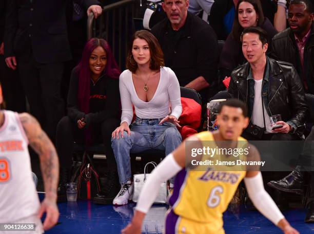 Bella Hadid is seen watching Jordan Clarkson during the New York Knicks Vs Los Angeles Lakers game at Madison Square Garden on December 12, 2017 in...