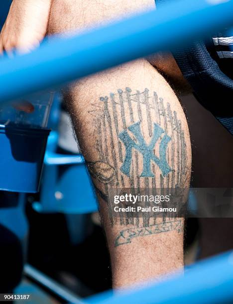 Fan of the New York Yankees sports a tattoo int the stands during the game against the Toronto Blue Jays on September 6, 2009 at the Rogers Centre in...