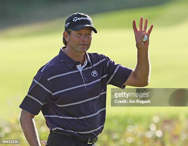 Ratief Goosen reacts on the 18th green during the third round of the Deutsche Bank Championship held at TPC Boston on September 6, 2009 in Norton,...
