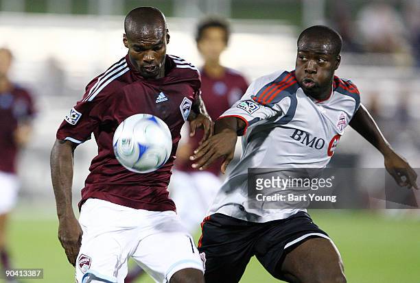 Omar Cummings of the Colorado Rapids fights for the ball against Nana Attakora of Toronto FC on September 5, 2009 at Dicks Sporting Goods Park in...