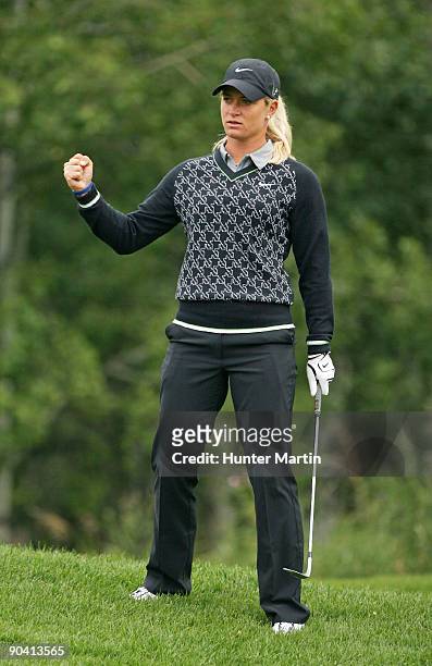 Suzann Pettersen of Norway fist pumps after chipping in for birdie on the 10th hole during the final round of the Canadian Women's Open at Priddis...
