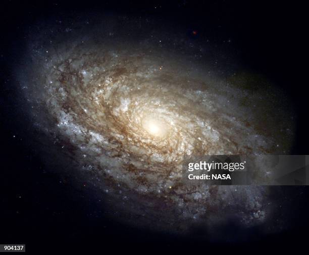 The majestic spiral galaxy NGC 4414 as photographed by the Hubble Space Telescope.