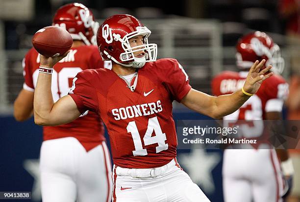 Quarterback Sam Bradford of the Oklahoma Sooners warms up before a game against the Brigham Young Cougars at Cowboys Stadium on September 5, 2009 in...