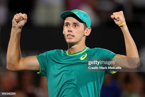 Alex de Minaur of Australia celebrates winning match point in his semi final match against Benoit Paire of France during day six of the 2018 Sydney...