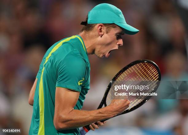 Alex de Minaur of Australia celebrates winning a point in his semi final match against Benoit Paire of France during day six of the 2018 Sydney...