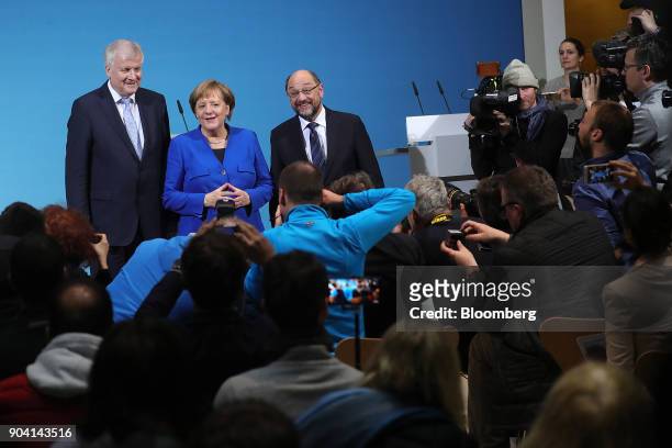 Horst Seehofer, leader of the Christian Social Union party, left, Angela Merkel, Germany's chancellor, center, and Martin Schulz, leader of the...
