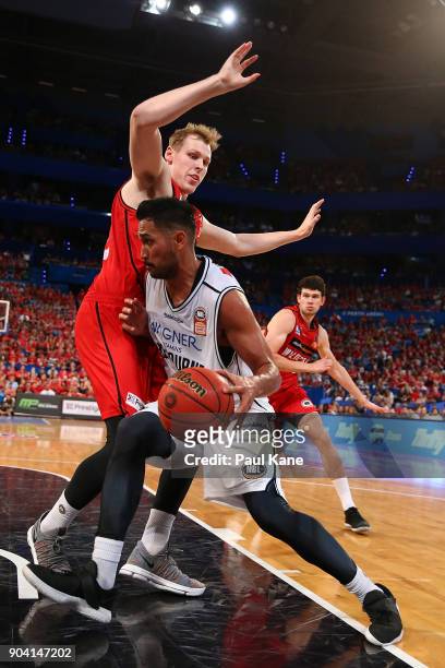 Tai Wesley of United works to the basket against Rhys Vague of the Wildcats during the round 14 NBL match between the Perth Wildcats and Melbourne...