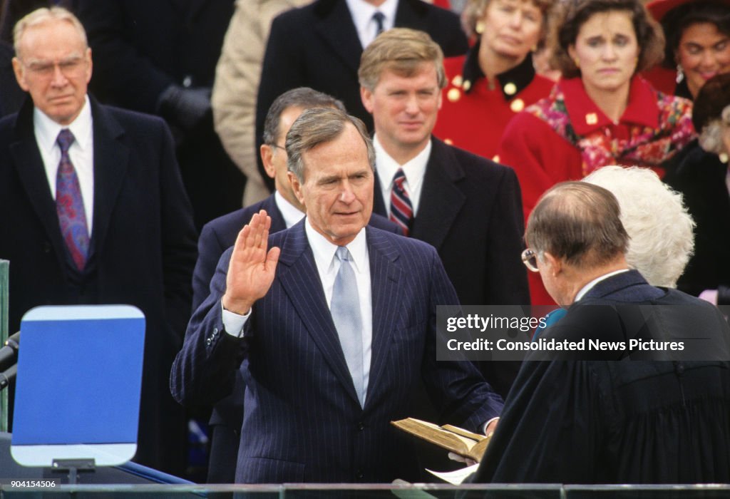 American politician George HW Bush takes the oath of office as he is ...