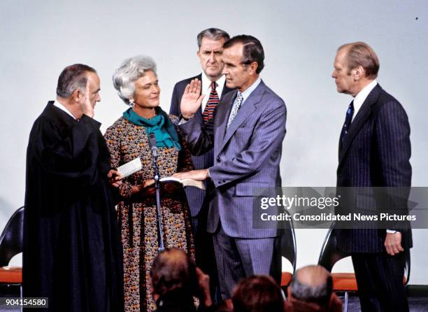 United States Supreme Court Associate Justice Potter Stewart swears in former Senator George HW Bush as Director of the Central Intelligence Agency...