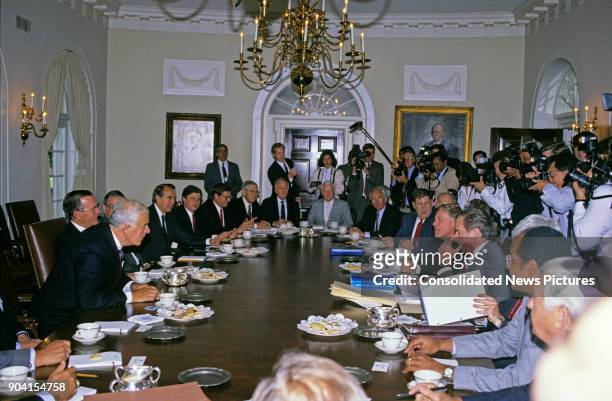 President George HW Bush meets with Congressional budget negotiators in the White House's Cabinet Room, Washington DC, May 15, 1990. Among those...