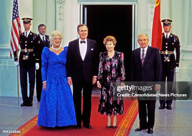 Portrait of, from left, US First Lady Barbara Bush, and her husband, US President George HW Bush, Raisa Gorbacheva and her husband, Soviet President...