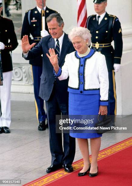 President George HW Bush and First Lady Barbara Bush wave from the White House's North Portico, Washington DC, June 3, 1990. They were bidding...