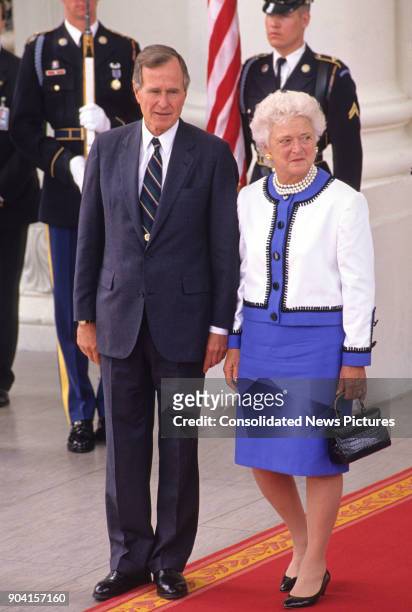 View of US President George HW Bush and First Lady Barbara Bush at the White House's North Portico, Washington DC, June 3, 1990. They were bidding...