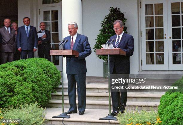 Russian President Boris Yeltsin and US President George HW Bush speak during a press conference in the White House's Rose Garden, Washington DC, June...