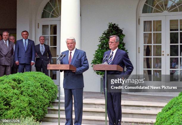 Russian President Boris Yeltsin and US President George HW Bush speak during a press conference in the White House's Rose Garden, Washington DC, June...