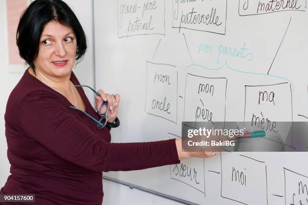 adults learning a french language - french language stock pictures, royalty-free photos & images