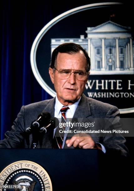 President George HW Bush speaks during a press conference in the White House's Brady Press Briefing Room, Washington DC, August 17, 1990.