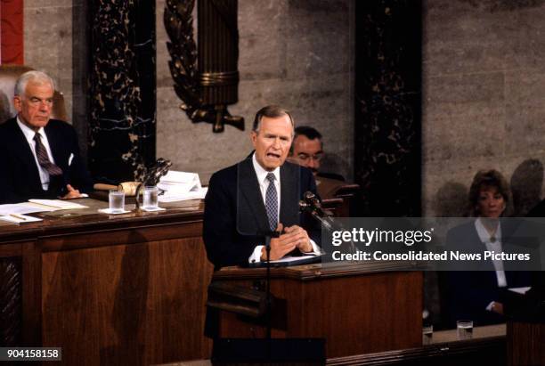 President George HW Bush addresses a joint session of the US Congress, Washington DC, September 11, 1990. At left, is Speaker of the House Tom Foley .