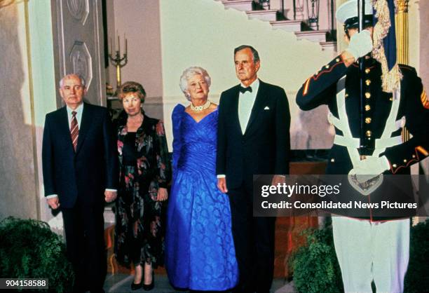 Portrait of, from left, Soviet President Mikhail Gorbachev and his wife, Raisa Gorbacheva , US First Lady Barbara Bush, and her husband, US President...