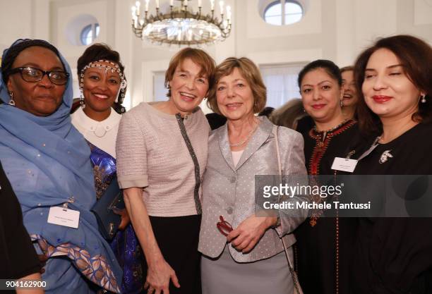 German First Lady Elke Buedenbender, center left poses with former German First Lady Daniela Schadt, center right, together with Ambassadors wives...