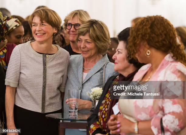 German First Lady Elke Buedenbender, left poses with former German First Lady Daniela Schadt, right, together with Ambassadors wives during the first...
