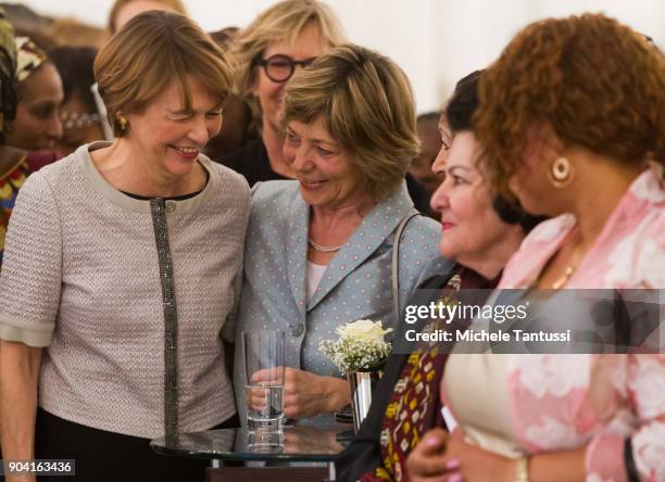 German First Lady Elke Buedenbender, left poses with former German First Lady Daniela Schadt, right, together with Ambassadors wives during the first...