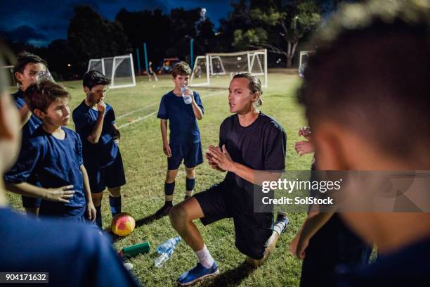 soccer team meeting - fitness coach stock pictures, royalty-free photos & images