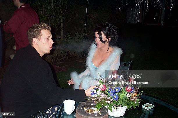 March 9, 2000 Los Angeles Jenny McCarty and her husband at The New School Pajama Party at the Playboy Mansion. The rock band Limp Bizkit joined...