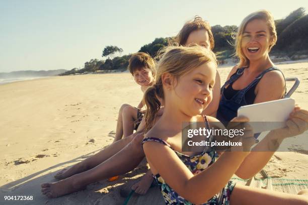 summer's all about the memories - person looking at phone while smiling australia stock pictures, royalty-free photos & images