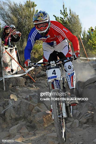 Steve Peat of Great Britain rides through the 'Rock Garden' on his way to winning gold in the elite men's downhill final at the UCI Mountain Bike...