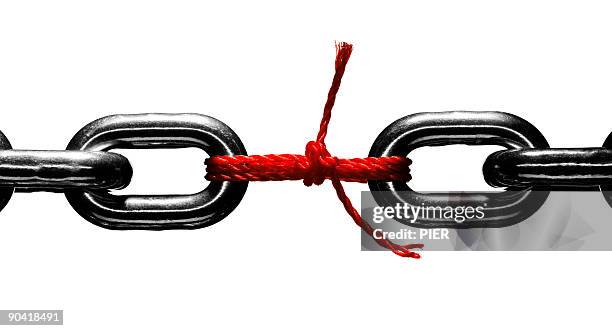 steel chain held together with red string - broken chain stock pictures, royalty-free photos & images