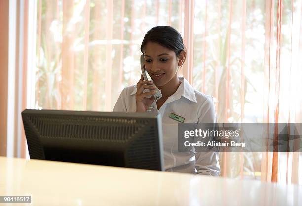 Hotel Receptionist Job Using Computer Hotel Receptionist On Computer Photos and Premium High Res Pictures ...
