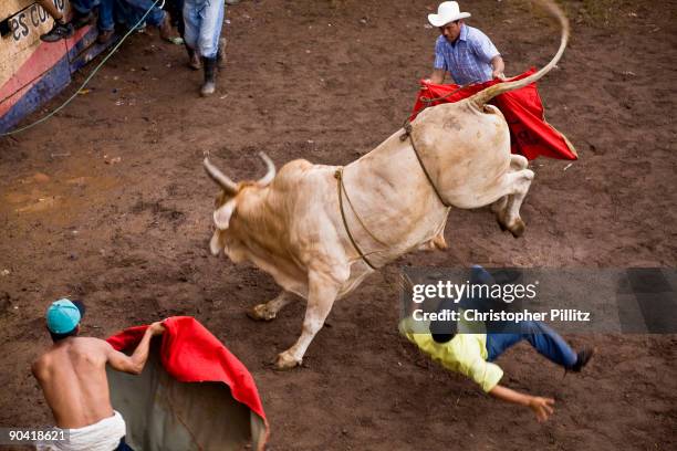 At "La Barrera" the very rudimentary bull ring in Juigalpa town the public and especially the testosterone driven young jump into the ring to...