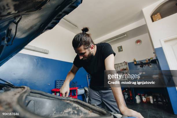 repairman working on car - engine failure stock pictures, royalty-free photos & images