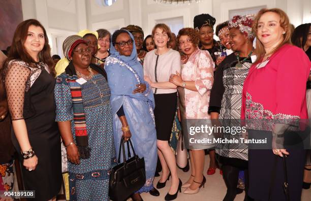 German First Lady Elke Buedenbender, center, poses with Ambassadors wives during the first Reception For Diplomatic Corp Wives in the Bellevue palace...