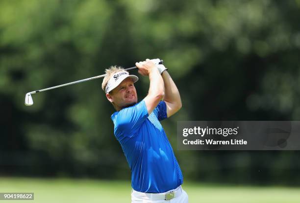 Soren Kjeldsen of Denmark plays his second shot on the 7th hole during day two of the BMW South African Open Championship at Glendower Golf Club on...