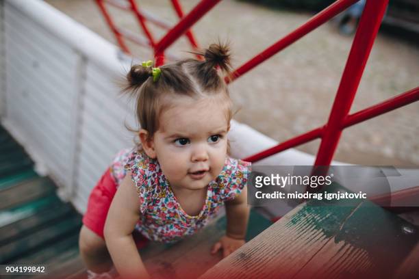 babygirl climbing the stairs - baby climbing stock pictures, royalty-free photos & images