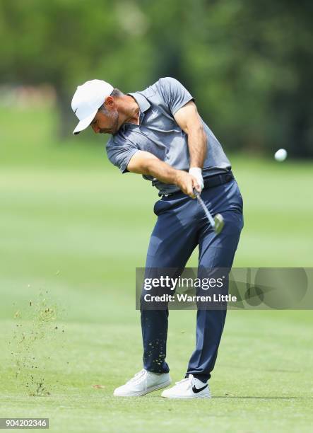 Trevor Immelman of South Africa plays his second shot on the 7th hole during day two of the BMW South African Open Championship at Glendower Golf...
