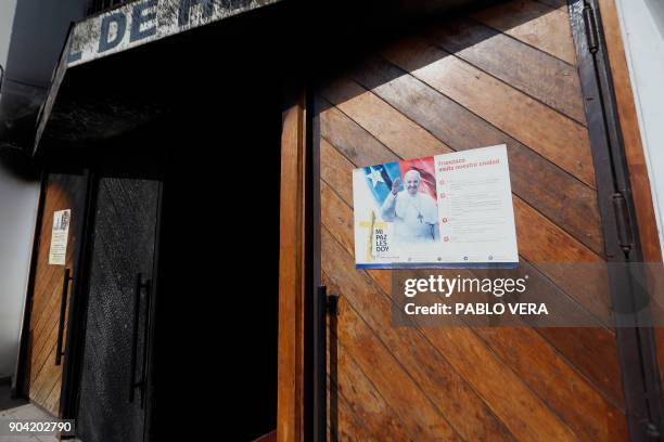 View of the burnt door of Santa Isabel de Hungria church in Santiago, where an attack with an incendiary device occured and a threating message...