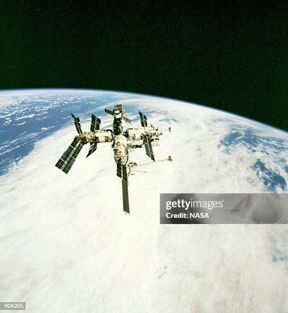 View of Russia's Mir Space Station from the Earth-orbiting Space Shuttle Endeavour following undocking of the two spacecraft January 30, 1998. A...