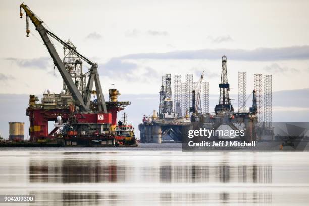 Oil rigs weighing thousands of tons are continuing to be stacked up in the Cromarty Firth on January 12, 2018 in Invergordon, Scotland. Rig platforms...