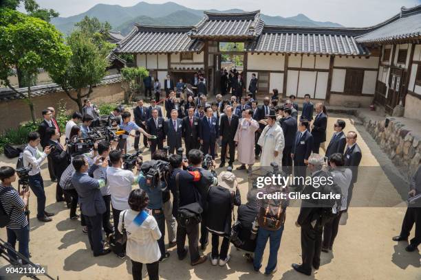 Crowd gathers in Andong Hahoe Village during a visit by UN Secretary General Ban ki-moon. The Hahoe Folk Village is a traditional village from the...