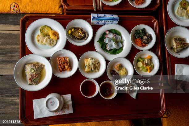 Plates and dishes of Korean food at the Andong traditional village The Hahoe Folk Village is a traditional village from the Joseon Dynasty. The 'Ha'...