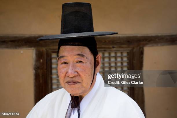 An elder from Andong village poses for a photograph. The Hahoe Folk Village is a traditional village from the Joseon Dynasty. The 'Ha' is short for...