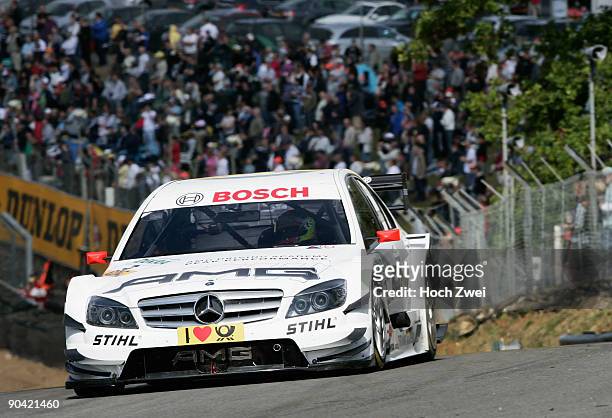 Paul Di Resta of Great Britain and AMG Mercedes drives on his way to winning the DTM 2009 German Touring Car Championship race at Brands Hatch on...