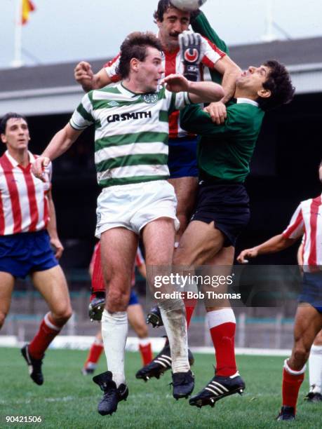 Brian McClair of Celtic clashes with Juan Arteche and goalkeeper Ubaldo Fillol of Athletico Madrid during the Celtic v Athletico Madrid European Cup...