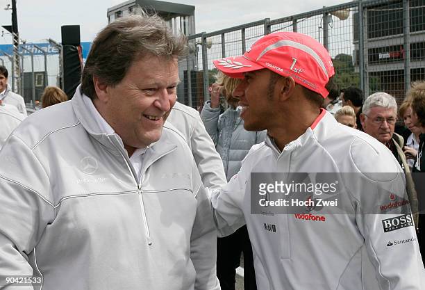 Formula One World Champion Lewis Hamilton of Great Britain and McLaren Mercedes talks with Vice-President of Mercedes Benz Motorsport Norbert Haug...