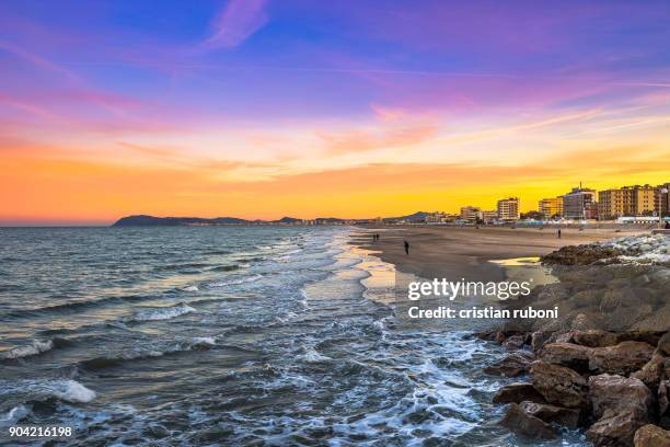 sunset at rimini beach, italy - rimini stock pictures, royalty-free photos & images