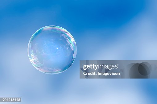 Soap bubble floating in a blue sky Soap bubble floating in a blue sky