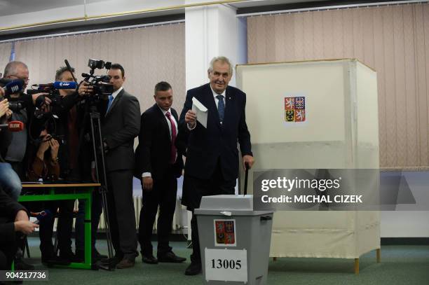 Czech President Milos Zeman arrives to cast his ballot at a polling station in Prague on January 12, 2018. The first round of the presidential...